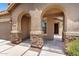 Stylish entryway featuring stone column accents and a neutral color palette creating an inviting entrance at 6557 S Classic Way, Gilbert, AZ 85298