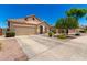 Inviting single-Gathering home boasts a tile roof, two-car garage, and well-kept landscaping, creating great curb appeal at 6557 S Classic Way, Gilbert, AZ 85298