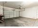 Spacious garage with an automatic door and room for storage and organization at 6557 S Classic Way, Gilbert, AZ 85298
