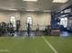 Community fitness center with modern exercise equipment and turf floors at 6557 S Classic Way, Gilbert, AZ 85298