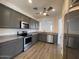 Modern kitchen featuring sleek countertops, stainless steel appliances, and an open layout at 6557 S Classic Way, Gilbert, AZ 85298