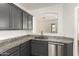 Kitchen area with granite countertops, stainless steel appliances and stainless steel dishwasher at 6557 S Classic Way, Gilbert, AZ 85298