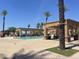 Inviting community pool area featuring palm trees, comfortable lounge chairs, and shaded cabanas for relaxation at 6557 S Classic Way, Gilbert, AZ 85298