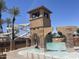 The pool area includes a tall slide, a tower with archways, and comfortable white lounge chairs at 6557 S Classic Way, Gilbert, AZ 85298