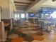 Spacious restaurant featuring stylish seating, hardwood floors, and a full bar, perfect for dining and socializing at 6557 S Classic Way, Gilbert, AZ 85298