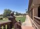 Exterior walkway with manicured landscaping and green grass at 6557 S Classic Way, Gilbert, AZ 85298