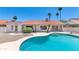 This backyard features a pool with a concrete pool deck at 8666 E Cheryl Dr, Scottsdale, AZ 85258