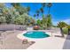 This backyard features a kidney shaped pool, and landscaped borders at 8666 E Cheryl Dr, Scottsdale, AZ 85258