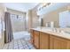 The bathroom features a tub-shower combo, a single sink and tile flooring at 8666 E Cheryl Dr, Scottsdale, AZ 85258