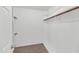 Walk-in closet with built-in shelving and carpeted floor at 8666 E Cheryl Dr, Scottsdale, AZ 85258