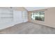 Living Room with a white built-in and a large window looking out to the pool at 8666 E Cheryl Dr, Scottsdale, AZ 85258
