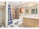 Bathroom featuring vanity, toilet and tub with shower at 11422 W Hidalgo Ave, Tolleson, AZ 85353