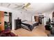 Spacious bedroom with hardwood floors, ceiling fan, and ample closet space at 11422 W Hidalgo Ave, Tolleson, AZ 85353