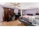 Spacious bedroom with laminate floor, ceiling fan, and large window at 11422 W Hidalgo Ave, Tolleson, AZ 85353