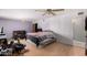 Large bedroom with sitting area, hardwood floors and a ceiling fan at 11422 W Hidalgo Ave, Tolleson, AZ 85353
