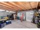 Spacious garage interior featuring exposed ceiling structure and concrete block walls at 11422 W Hidalgo Ave, Tolleson, AZ 85353