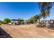 Expansive land featuring gravel parking and various work areas under bright sunny skies at 11422 W Hidalgo Ave, Tolleson, AZ 85353