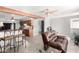 Open-concept living area with bar seating and a comfortable layout at 11422 W Hidalgo Ave, Tolleson, AZ 85353