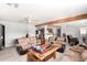 Open-concept living room with a ceiling fan, wood beam, and comfortable seating at 11422 W Hidalgo Ave, Tolleson, AZ 85353