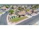 Aerial view of home featuring a well-maintained lawn, landscaped yard, and a refreshing backyard pool at 1210 W Stottler Dr, Chandler, AZ 85224