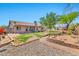 Expansive backyard featuring mature landscaping and a charming brick-lined garden area at 1210 W Stottler Dr, Chandler, AZ 85224