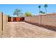 Large backyard is fully fenced with mature block wall and wide gate for access at 1210 W Stottler Dr, Chandler, AZ 85224