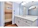 Bathroom featuring a white vanity, mirror, and separate shower, creating a clean and functional space at 1210 W Stottler Dr, Chandler, AZ 85224