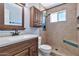 Bathroom featuring a vanity with framed mirror, and a tiled shower with built-in bench at 1210 W Stottler Dr, Chandler, AZ 85224