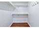 Interior view of a walk-in closet featuring shelving and rod for organization at 1210 W Stottler Dr, Chandler, AZ 85224