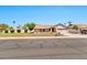 Charming single-story home featuring a well-manicured lawn and a two-car garage with inviting curb appeal at 1210 W Stottler Dr, Chandler, AZ 85224