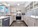 Stylish kitchen featuring stainless steel appliances, white cabinets, and modern finishes at 1210 W Stottler Dr, Chandler, AZ 85224