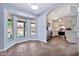 Bright kitchen and eat-in nook, with stainless appliances, white cabinets, and large windows at 1210 W Stottler Dr, Chandler, AZ 85224
