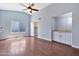 Bright, expansive living area showcasing wood floors, high ceilings, and a built-in bar at 1210 W Stottler Dr, Chandler, AZ 85224