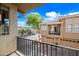 Balcony view of community and neighbor's building with green trees, blue sky and great lighting at 1225 N 36Th St # 2119, Phoenix, AZ 85008