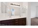 Bathroom features a dual sink vanity, framed mirrors, and a light fixture above at 1225 N 36Th St # 2119, Phoenix, AZ 85008