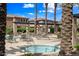 Community amenities include a relaxing hot tub with surrounding lounge chairs and mature palm trees at 1225 N 36Th St # 2119, Phoenix, AZ 85008