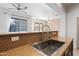 Kitchen counter and sink overlooking living area, offering an open layout and natural light at 1225 N 36Th St # 2119, Phoenix, AZ 85008