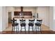Kitchen island offers seating with barstools and granite countertops with stainless appliances at 1225 N 36Th St # 2119, Phoenix, AZ 85008
