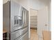 Modern stainless refrigerator and open pantry space in this spacious kitchen at 1225 N 36Th St # 2119, Phoenix, AZ 85008