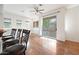 Bright living room with hardwood floors, natural light, and a sliding door leading to a balcony at 1225 N 36Th St # 2119, Phoenix, AZ 85008