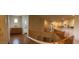 Hallway featuring wood floors, wood railings, and natural light at 12518 W Milton Dr, Peoria, AZ 85383