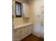 Well-lit laundry room with ample counter space and storage at 12518 W Milton Dr, Peoria, AZ 85383