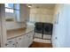 Laundry room with lots of cabinets and counter space, and a washer and dryer at 12518 W Milton Dr, Peoria, AZ 85383