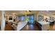 Spacious living room with a large sectional sofa, fireplace, and access to the backyard through shuttered doors at 12518 W Milton Dr, Peoria, AZ 85383