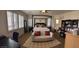 Spacious main bedroom with a sitting area, natural light, and stylish decor at 12518 W Milton Dr, Peoria, AZ 85383