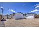 View of gravel backyard with white storage shed offering ample outdoor storage at 1263 W Devonshire St, Mesa, AZ 85201