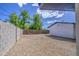 Large gravel backyard featuring wood and block fence providing a blank canvas for outdoor enjoyment at 1263 W Devonshire St, Mesa, AZ 85201