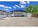 Backyard carport with storage and concrete area, showcasing a practical outdoor living space at 1263 W Devonshire St, Mesa, AZ 85201
