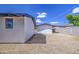 Side view of gravel backyard featuring low maintenance landscaping at 1263 W Devonshire St, Mesa, AZ 85201