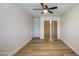 Bedroom featuring light wood flooring, bi-fold closet doors, and neutral walls at 1263 W Devonshire St, Mesa, AZ 85201